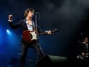 Alex Turner (L) of the Arctic Monkeys performs during a concert. PAUL BERGEN/ANP/AFP via Getty Images