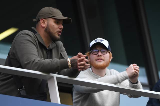 Pop Music singer songwriter Ed Sheeran (r) looks on from the hospitality boxes during day one of the 4th Ashes Test match between England and Australia at Old Trafford on September 04, 2019 in Manchester, England. (Photo by Stu Forster/Getty Images)