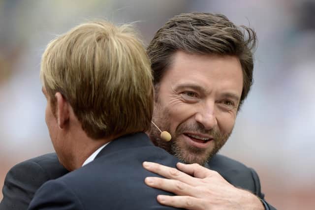 Actor Hugh Jackman greets former Australian cricketer Shane Warne during day one of the Fourth Ashes Test Match between Australia and England at Melbourne Cricket Ground on December 26, 2013 in Melbourne, Australia.  (Photo by Gareth Copley/Getty Images)
