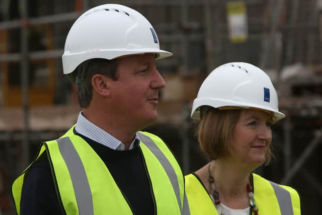 Then British Prime Minister David Cameron (L) and Labour MP Harriet Harman, tour a Crest Nicholson residential house construction site on June 22, 2016 in Swindon, United Kingdom. (Photo by Geoff Caddock - WPA Pool/Getty Images)