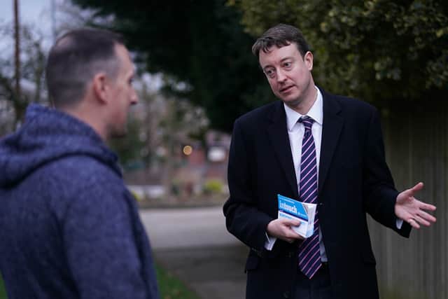 Simon Clarke MP, Chief Secretary to the Treasury and MP for Middlesbrough South and East Cleveland meets a resident as he canvasses in Nunthorpe on March 10, 2022 in Middlesbrough, England. (Photo by Ian Forsyth/Getty Images)
