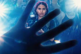 The poster for Black Mirror Season 6 episode 4 Mazey Day. It depicts Zazie Beetz as photographer Bo, seen obscured through a splayed hand (Credit: Netflix)