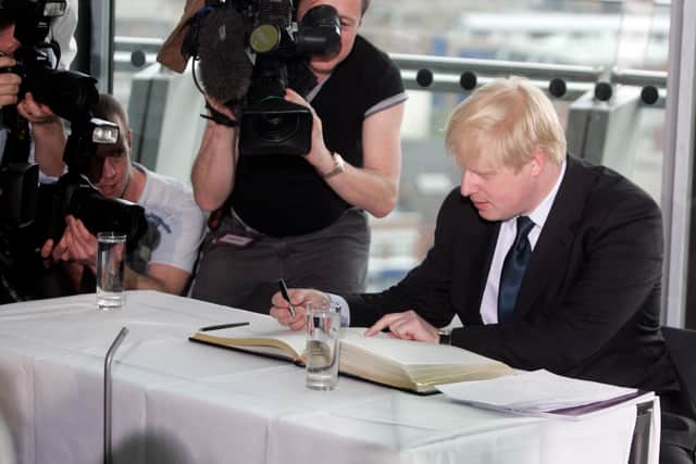 London Mayor Boris Johnson signs the declaration of acceptance of office at City Hall on May 3, 2008 in London, England. Conservative Johnson's victory over incumbent London Mayor Ken Livingston added to the weight of Labour Party defeat in local elections across the country. (Photo by William Wintercross/Getty Images)