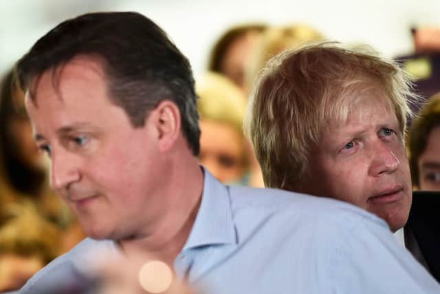 Prime Minister David Cameron speaks as London Mayor Boris Johnson looks on at an election rally in Hendon on May 5, 2015 in Twickenham, London. Britain will go to the polls in a national election in just two days time. (Photo by Toby Melville - WPA Pool /Getty Images)