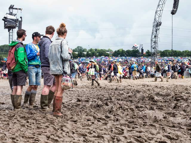 Festival goers cope with muddy conditions on day 2 of the Glastonbury Festival at Worthy Farm, Pilton on June 25, 2016 in Glastonbury, England. Now in its 46th year the festival is one largest music festivals in the world and this year features headline acts Muse, Adele and Coldplay. The Festival, which Michael Eavis started in 1970 when several hundred hippies paid just Â£1, now attracts more than 175,000 people.  (Photo by Ian Gavan/Getty Images)