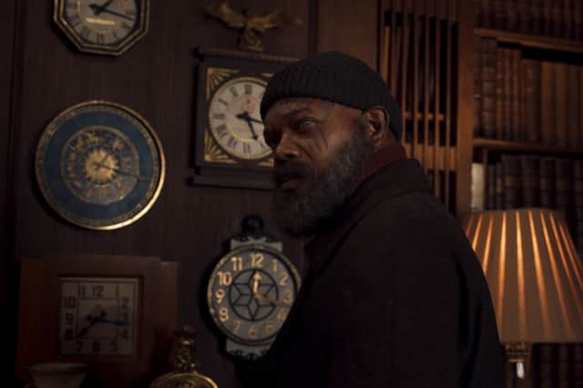 Samuel L. Jackson as Nick Fury in Secret Invasion, stood next to a wall of clocks (Credit: Marvel Studios)