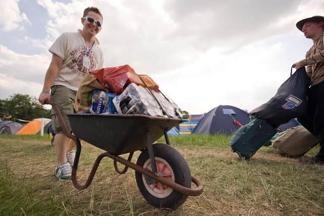 A man arrives with his beer supplies on the first day of Glastonbury 2009 (Photo: Leon Neal/AFP via Getty Images)