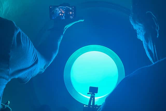 The viewing window in the 5 person Titan submersible while diving into the depths to the Titanic wreckage (Credit: OceanGate)