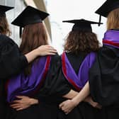 Stock Image: Students and family pose for photographs ahead of their graduation ceremony at the Royal Festival Hall on July 15, 2014 in London, England. Credit: Getty Images