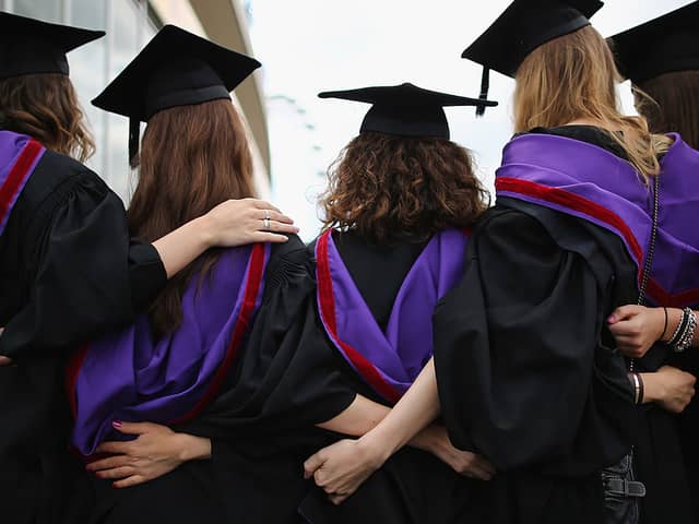 Stock Image: Students and family pose for photographs ahead of their graduation ceremony at the Royal Festival Hall on July 15, 2014 in London, England. Credit: Getty Images