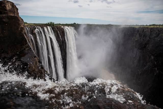 Mist rise from the gorge at the Victoria Falls in Livingstone on January 23, 2020. - The Victoria Falls, a UNESCO world heritage site measuring 108 meters high and almost 2km wide. (Photo by GUILLEM SARTORIO/AFP via Getty Images)