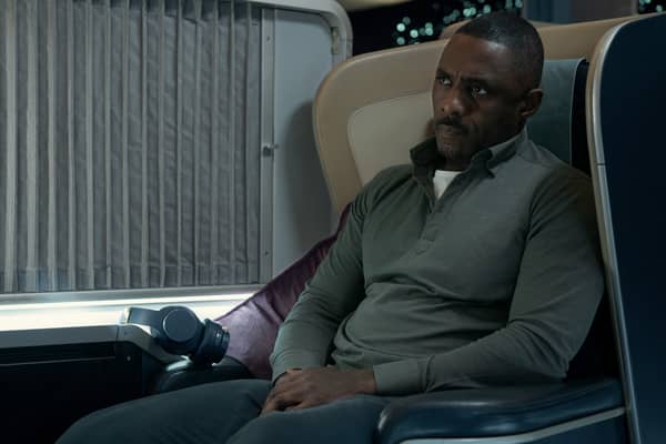 Idris Elba as Sam Nelson in Hijack, flying in business class (Credit: Apple TV+)