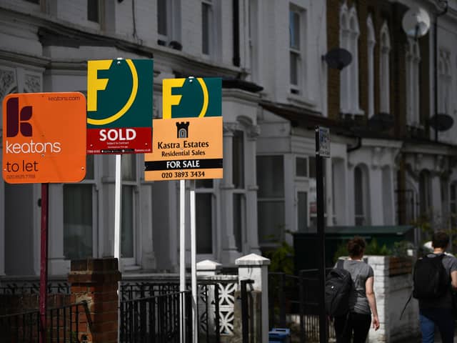 House prices are dropping by more than 5% in more than four out of ten sales, according to a new report by real estate company Zoopla. (Credit: AFP via Getty Images)