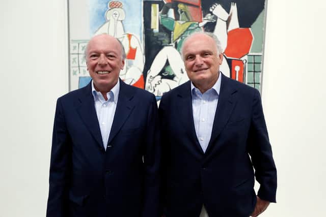 Art dealers David Nahmad and his brother Ezra Nahmad pose in a room of the exhibition dedicated to Spanish painter Pablo Picasso, on July 12, 2013 at the Grimaldi Forum in Monaco.  (Photo credit: VALERY HACHE/AFP via Getty Images)