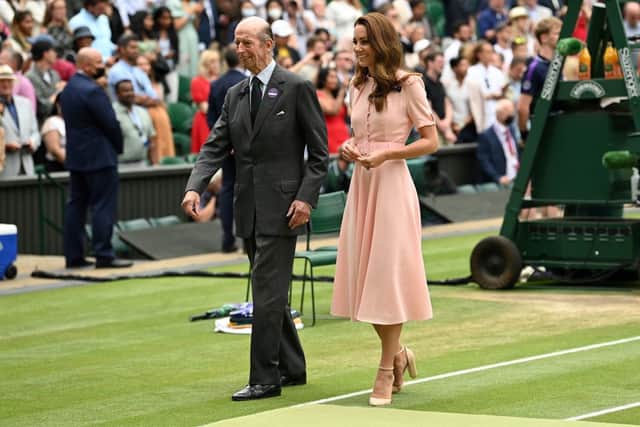 The Princess of Wales walks off court with Britain's Prince Edward, Duke of Kent, after presenting the trophies following the men's singles final on the thirteenth day of the 2021 Wimbledon Championships at The All England Tennis Club in Wimbledon, southwest London, on July 11, 2021. - Serbia's Novak Djokovic beat Italy's Matteo Berrettini. -  (Photo by Glyn KIRK / AFP) 