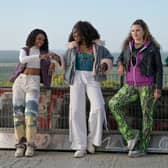 Yasmin Monet Prince as Ruth, Vivian Oparah as Stink, Isidorah Fairhurst as Nessi, and Leah McNamara as Tara in Then You Run, stood on a graffitied bridge (Credit: Sky/Bernd Spauke) 