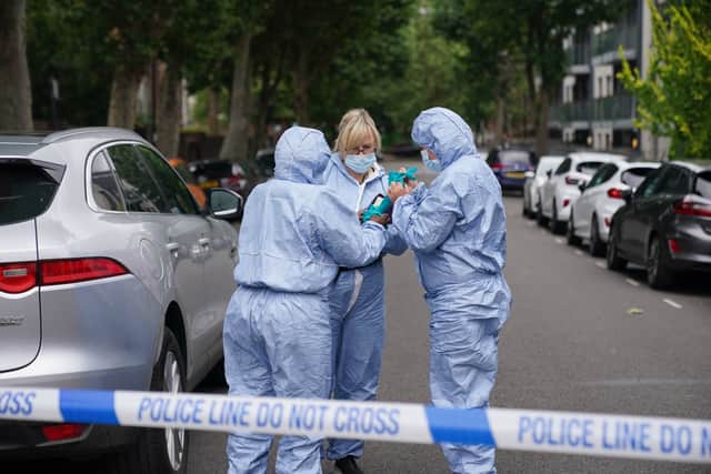 Forensic officers in Elthorne Road, Islington. Picture: Lucy North/PA Wire 