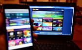 File photo dated 28/12/15 of the William Hill gambling website on a phone and a laptop. Picture: PA