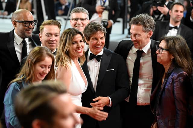 Tom Cruise and fans leave the screening of "Top Gun: Maverick" during the 75th annual Cannes film festival at Palais des Festivals on May 18, 2022 in Cannes, France. (Photo by Joe Maher/Getty Images)