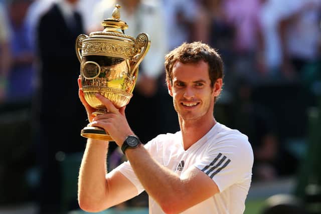 Andy Murray poses with his Wimbledon trophy in 2013