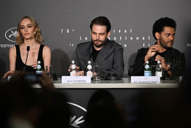 (From L) French-US actress Lily-Rose Depp, US director Sam Levinson and Canadian singer Abel Makkonen Tesfaye aka The Weeknd attend a press conference for the film "The Idol" during the 76th edition of the Cannes Film Festival in Cannes, southern France, on May 23, 2023. (Photo by Julie SEBADELHA / AFP) (Photo by JULIE SEBADELHA/AFP via Getty Images)