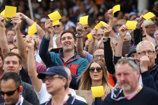England fans show off their yellow sandpaper during day one of the First Specsavers Ashes Test Match between England and Australia at Edgbaston on August 01, 2019 in Birmingham, England. (Photo by Stu Forster/Getty Images)