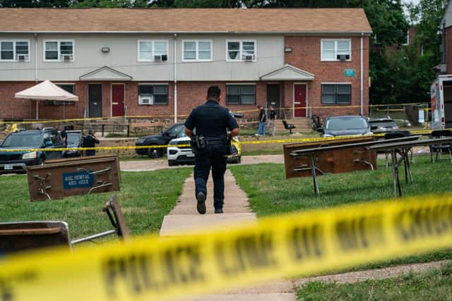 Baltimore Police investigate the site of a mass shooting in the Brooklyn Homes neighbourhood on July 2, 2023 in Baltimore, Maryland. (Photo by Nathan Howard/Getty Images)