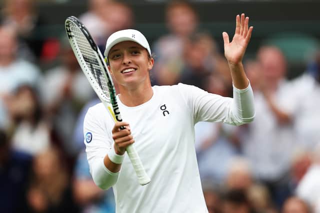 Iga Swiatek of Poland celebrates winning match point against Lin Zhu of People's Republic of China in the Women's Singles first round match during day one of The Championships Wimbledon 2023 at All England Lawn Tennis and Croquet Club on July 03, 2023 in London, England. (Photo by Julian Finney/Getty Images)