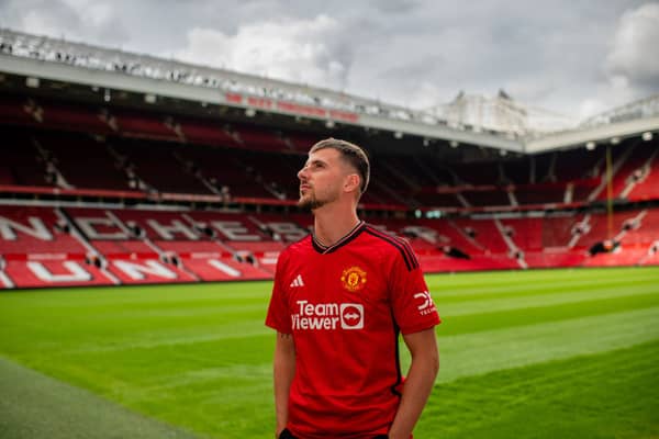 Mason Mount poses at Old Trafford following move to Manchester United