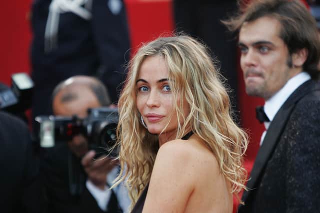 CANNES, France:  French actress Emmanuelle Beart arrives to attend the premiere of Serbian director Emir Kusturica's film "Zivot Je Cudo (Life is a Miracle)", 14 May 2004 during the 57th Cannes Film Festival in the French Riviera town. Kusturica, already a two-time Palme D'Or winner, is competing for the festival's top prize for a third time.  AFP PHOTO BORIS HORVAT  (Photo credit should read BORIS HORVAT/AFP via Getty Images)