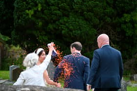 George Osbourne and Thea Rogers covered in orange confetti. Picture: SWNS