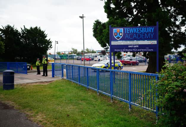 Emergency services at Tewkesbury School in Gloucesershire, where a teenage boy was arrested following reports a pupil stabbed a teacher (Photo: Ben Birchall/PA Wire)