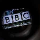 LONDON, ENGLAND - JULY 10: The logo on the front of BBC Broadcasting House is seen through a televison camera viewfinder on July 10, 2023 in London, England. Last week, the Sun newspaper published allegations that a BBC presenter had paid tens of thousands of pounds to a teenager in exchange for explicit photos. The broadcaster has said that a male presenter has been suspended while it conducts an investigation. (Photo by Leon Neal/Getty Images)