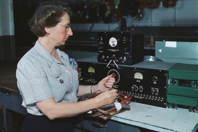 Woman electric wiring technician at Douglas Aircraft Company, Long Beach, California. During World War 2, Oct. 1942