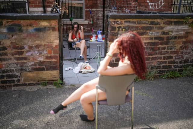 Residents relax outside their home during summer 2022, as temperatures exceeded 40C in parts of England (Photo: Christopher Furlong/Getty Images)