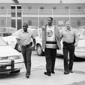 American rapper Snoop Dogg is escorted in handcuffs by two police officers following his arrest on charges of suspicion of posession of marijuana, circa 1995. (Photo by Hulton Archive/Getty Images)  