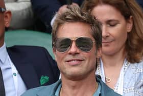 US actor Brad Pitt watches the men's singles final tennis match between Spain's Carlos Alcaraz and Serbia's Novak Djokovic on the last day of the 2023 Wimbledon Championships at The All England Tennis Club in Wimbledon, southwest London, on July 16, 2023. (Photo by Adrian DENNIS / AFP) / RESTRICTED TO EDITORIAL USE (Photo by ADRIAN DENNIS/AFP via Getty Images)
