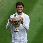 LONDON, ENGLAND - JULY 16: Carlos Alcaraz of Spain celebrates with the Men's Singles Trophy following his victory in the Men's Singles Final against Novak Djokovic of Serbia on day fourteen of The Championships Wimbledon 2023 at All England Lawn Tennis and Croquet Club on July 16, 2023 in London, England. (Photo by Patrick Smith/Getty Images)