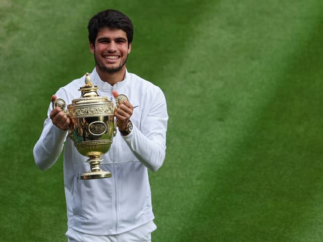 LONDON, ENGLAND - JULY 16: Carlos Alcaraz of Spain celebrates with the Men's Singles Trophy following his victory in the Men's Singles Final against Novak Djokovic of Serbia on day fourteen of The Championships Wimbledon 2023 at All England Lawn Tennis and Croquet Club on July 16, 2023 in London, England. (Photo by Patrick Smith/Getty Images)