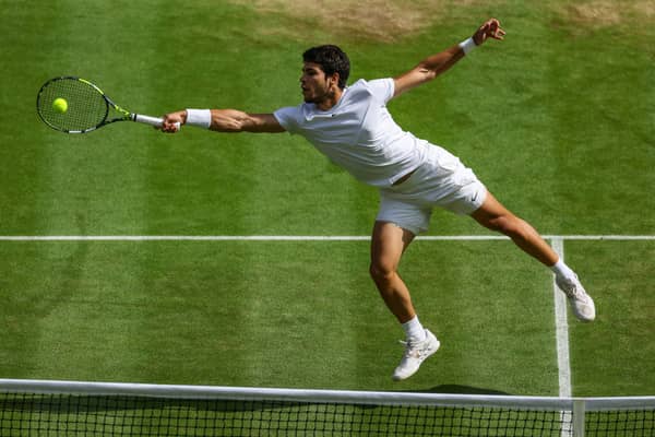 LONDON, ENGLAND - JULY 16: Carlos Alcaraz of Spain plays a forehand shot during the Men's Singles Final against Novak Djokovic of Serbia on day fourteen of The Championships Wimbledon 2023 at All England Lawn Tennis and Croquet Club on July 16, 2023 in London, England. (Photo by Patrick Smith/Getty Images)