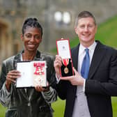 WINDSOR, UNITED KINGDOM - NOVEMBER 30:  Sharon White poses with her award after she was made a Dame CBE, for public service, next to her husband Sir Robert Chote posing with his award after he was made a Knight Bachelor, for services to fiscal policy and to the economy, at an investiture ceremony at Windsor Castle on November 30, 2021 in Windsor, England.  (Photo by Andrew Matthews - WPA Pool/Getty Images)