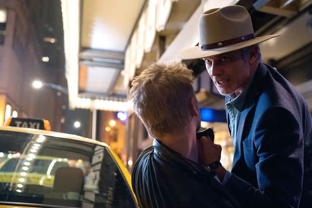 Timothy Olyphant as Raylan Givens in Justified: City Primeval, threatening someone against a taxi (Credit: Chuck Hodes/FX)