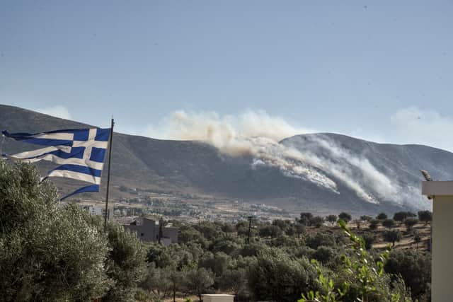 Wildfire have ripped through villages and towns outside of Athens as the heatwave hitting Europe continues to cause problems. (Credit: AFP via Getty Images)