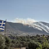 Wildfire have ripped through villages and towns outside of Athens as the heatwave hitting Europe continues to cause problems. (Credit: AFP via Getty Images)