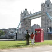 LONDON, ENGLAND - JULY 12: A pink TARDIS from Doctor Who has landed on the banks of Tower Bridge at Potterâs Fields on July 12, 2023 in London, England. (Photo by John Phillips/Getty Images for Warner Bros.)