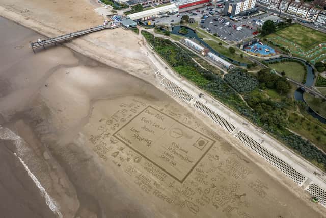 Sand ‘postcard’ to Sunak drawn on UK beach as erosion threat ‘ignored’. (Photo: Sand In Your Eye/Rights Community Action/PA Wire) 