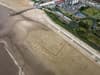 Sand ‘postcard’ to Rishi Sunak drawn on UK beach as erosion threat to areas living ‘on the edge’ are ‘ignored’