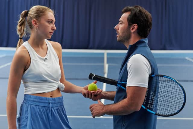 Ella Lily Hyland as Justine Pierce and Aidan Turner as Glenn Lapthorne in Fifteen-Love, exchanging a tennis ball (Credit: Rob Youngson/Amazon Prime Studios)