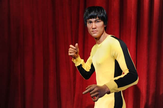 Madame Tussauds New York welcomes Bruce Lee's wax figure for a limited time at Madame Tussauds on August 13, 2014 in New York City.  (Photo by Craig Barritt/Getty Images for Madame Tussauds)