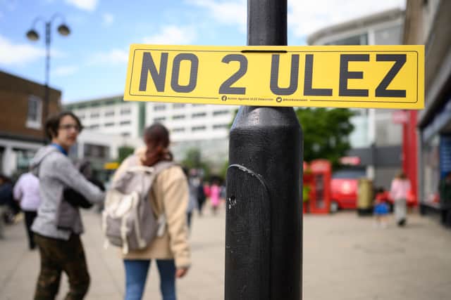 A "NO 2 ULEZ" sign is seen in a shopping precinct on July 19, 2023 in Uxbridge, England.  (Photo by Leon Neal/Getty Images)